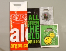 Plastic bags with slotted handle